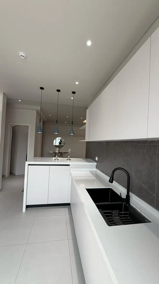 Long white kitchen worktop inside a residence